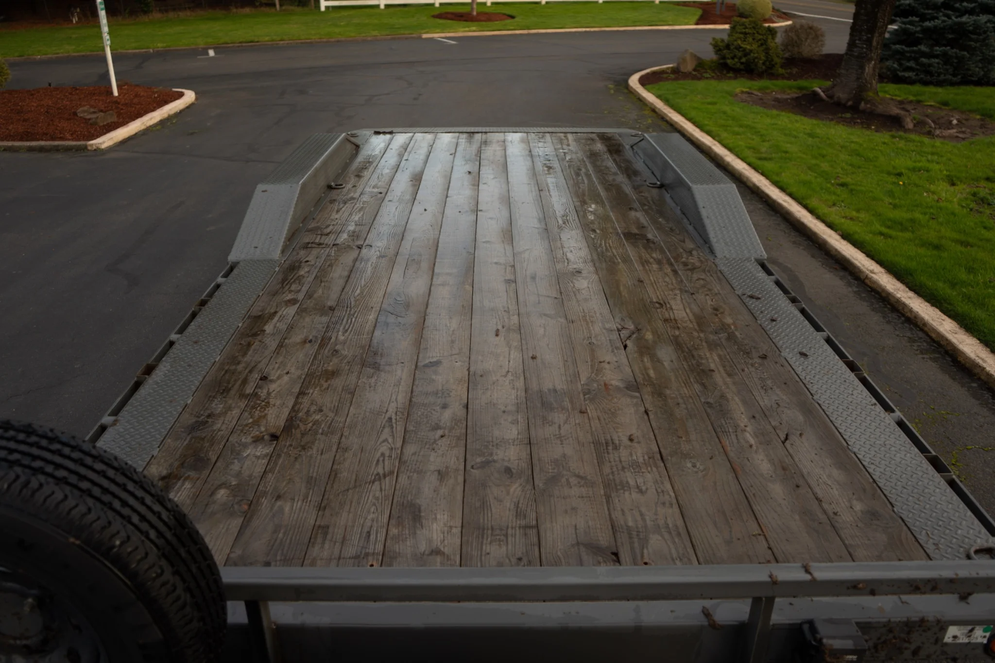 8.5×20 car hauler — wood deck with drive-over fenders